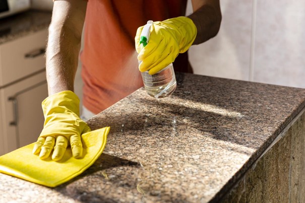 The best way to deal with dullness on granite countertops is to clean it properly. Using a nonabrasive cloth to clean the countertops with a vinegar and water solution will dissolve dirt and film buildup, bringing back the shine of your countertop. If you have white granite, you can use a stone sealer to protect it against staining.