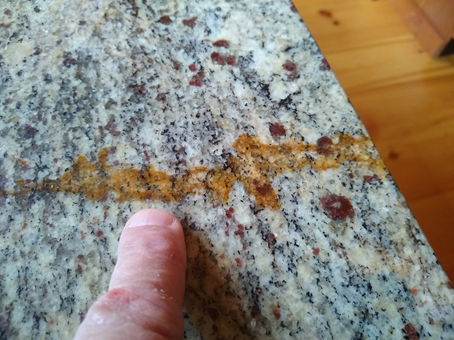 If you have a stain on your granite countertops, it is possible to remove it with the right tools. Some techniques include using a paper towel folded several times to soak the stain in acetone. Others involve using a razor blade to scrape the stain. You can also apply a poultice that will soak up the stain.