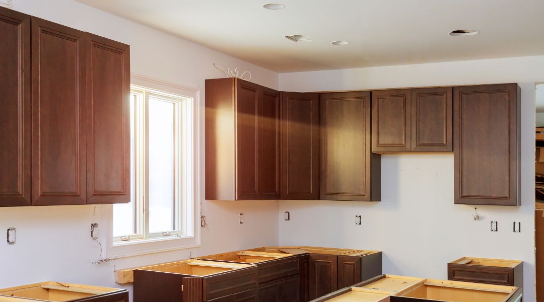 Oak cabinet remodeling with quartz countertops in Virginia