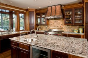 Granite-topped kitchen island with a single sink in an authentic kitchen