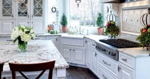 Granite-topped dining table with a vase of white flowers on it