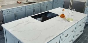 Quartz-topped kitchen island with condiment set on it