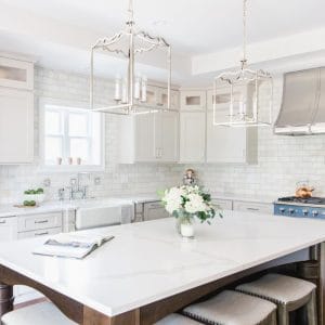 Quartz-topped dining table with a vase of white flowers on it