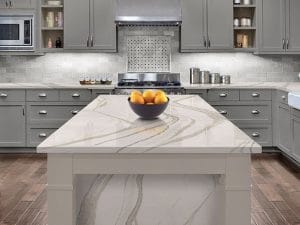 Quartz-topped dining table with grey cabinets