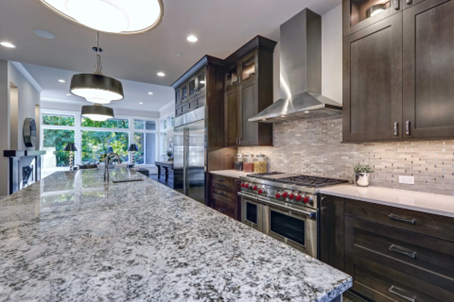 Granite-topped kitchen island with authentic cabinets