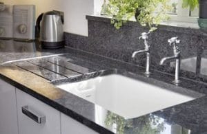 Gray granite countertop with double taps